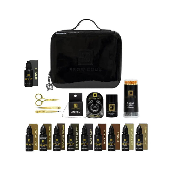 Brow Code Hybrid Dye Stain Kit featuring 10 brow stain shades, scissors, tweezers, mixing tools, tinting brushes, and a sleek black Brow Code case