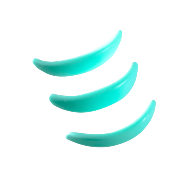 Close-up of three Élan Lower Lashes Shields in turquoise, used to isolate and protect lower lashes during lamination procedures