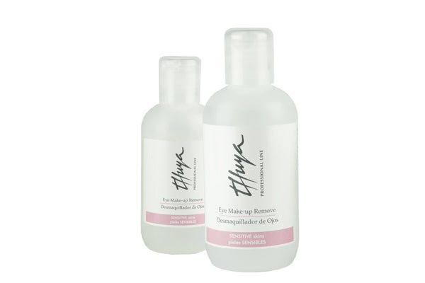 Two transparent bottles of Thuya Eye Make-up Remover for sensitive skin with flip-top caps and soft pink label detailing.
