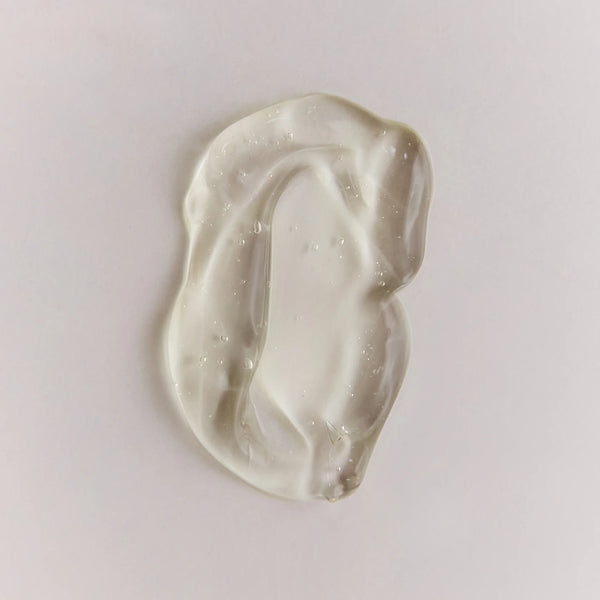 Close-up of Brow Code Arch Aid Post Wax Renewal Gel texture, showcasing the clear, lightweight gel consistency on a clean white surface