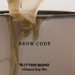 Brow Code Butter Bond Advanced Strip Wax in a beige 400mL tub with white lid, formulated for professional brow waxing and smooth hair removal