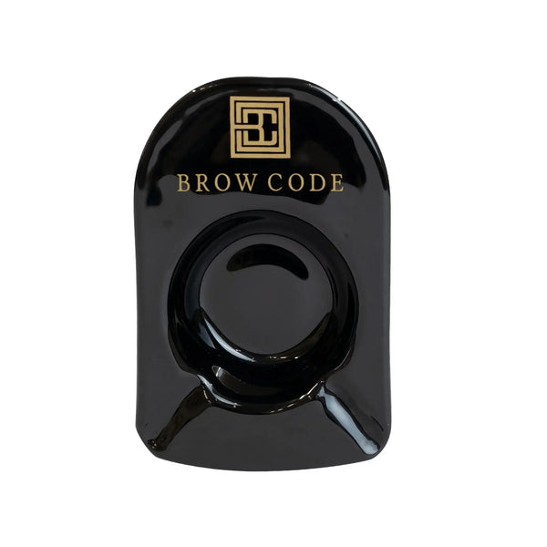 Brow Code Glass Mixing Dish – sleek black dish with gold branding, ideal for mixing brow tint and henna with precision