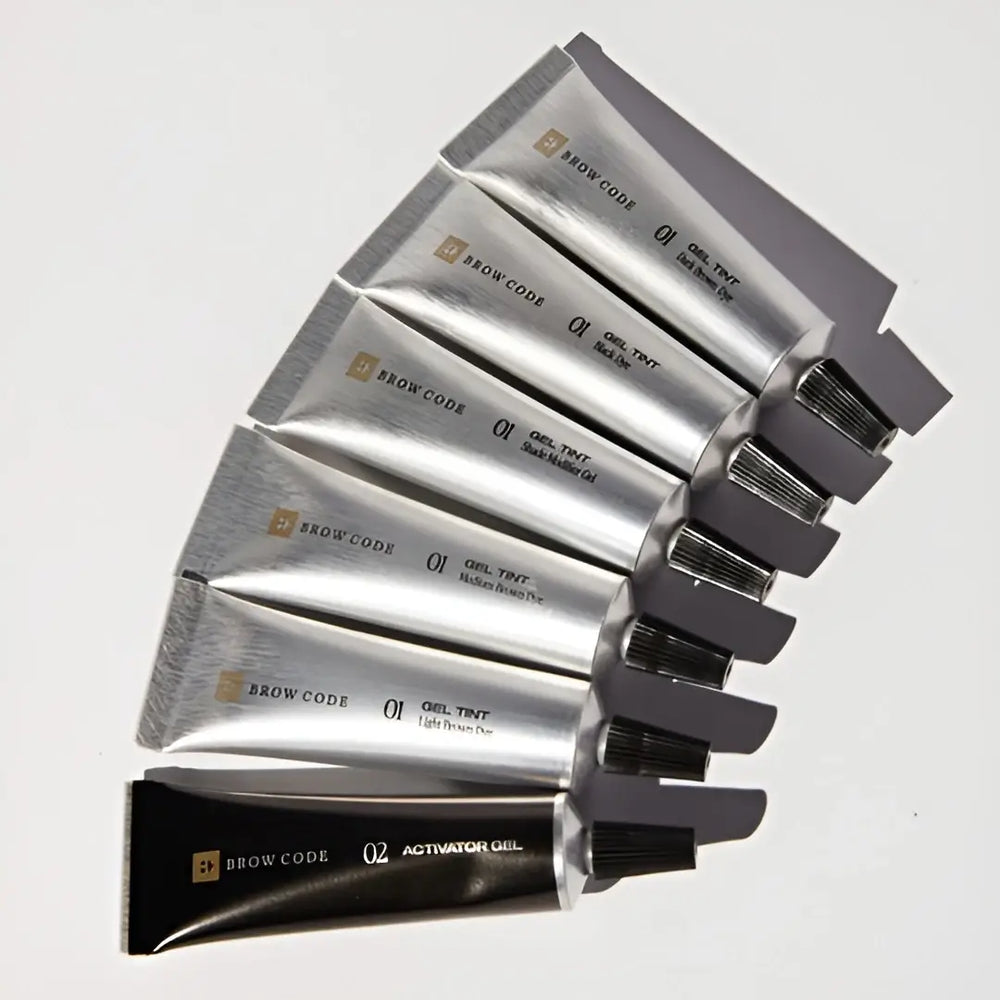 Five silver Brow code gel tint ppd free with black caps on a white background