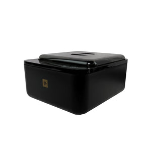 Angled view of Brow Code black wax warmer featuring sleek design with gold logo and digital temperature control panel under lid