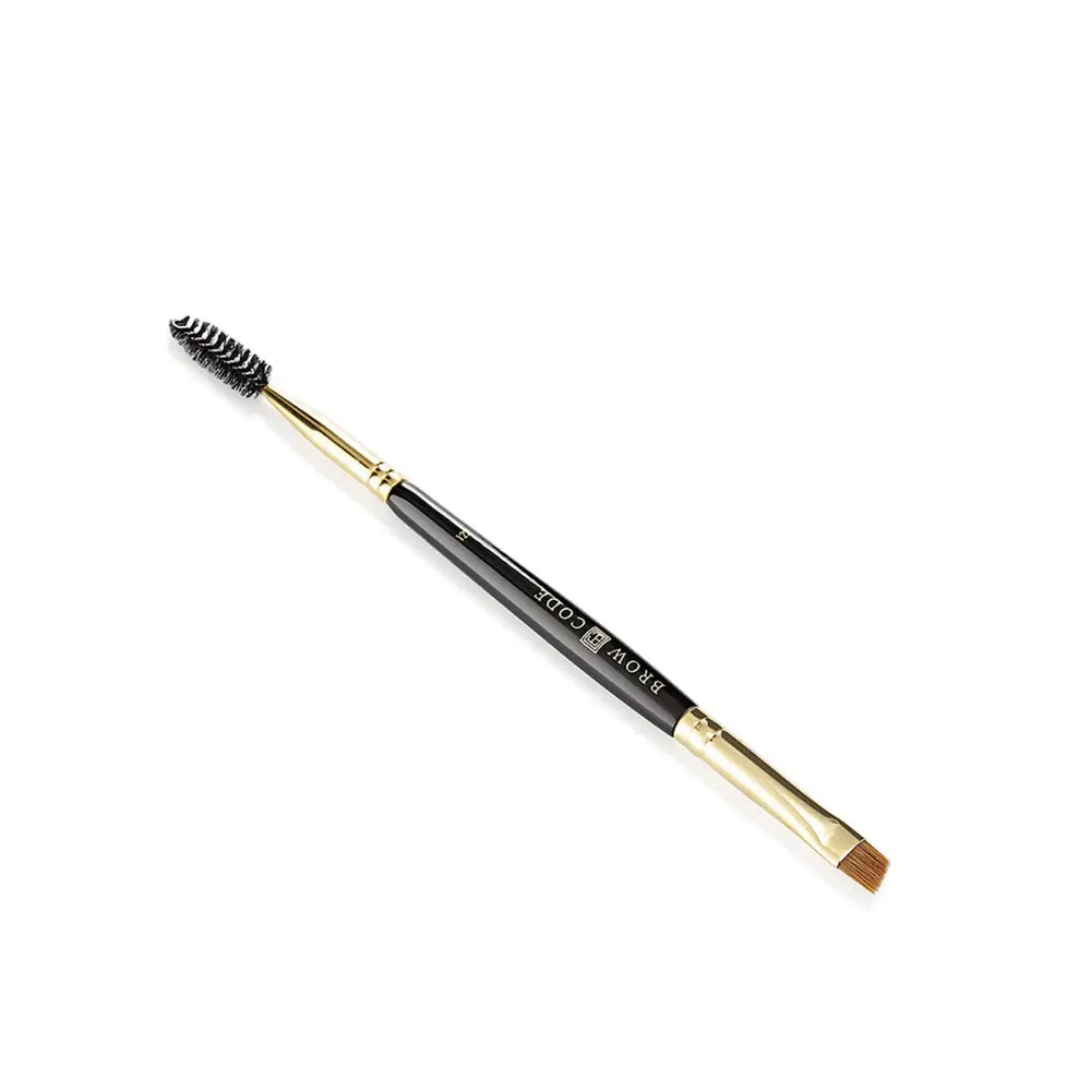 Brow Code 122 Define & Line brush with a spoolie and angled tip, displayed in gold packaging.