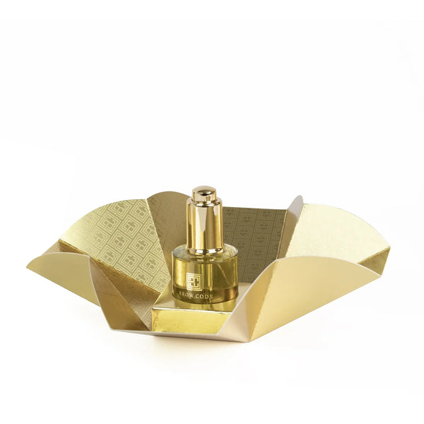 Brow Code Brow Gold Growth Oil 30ml in luxurious gold packaging, designed to nourish, strengthen, and promote healthy eyebrow growth