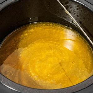 Melted Brow Code Design & Define hot wax in a warmer, ready for precise brow styling and hair removal