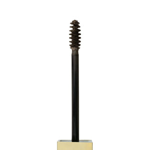 Close-up of Brow Code Tinted Brow Gel spoolie applicator with product on the brush, designed for precise brow tinting, shaping, and styling