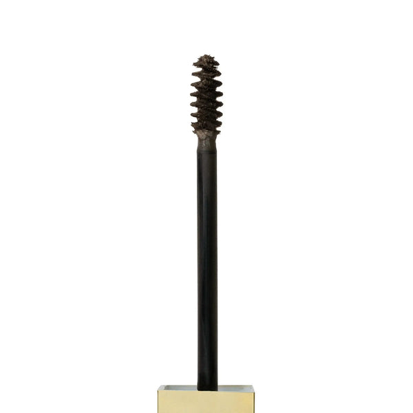 Close-up of Brow Code Tinted Brow Gel spoolie applicator with product on the brush, designed for precise brow tinting, shaping, and styling