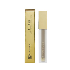 Brow Code Tinted Multi-Peptide Brow Gel in Taupe, featuring a frosted tube with a gold cap and matching gold box for defining and nourishing brows