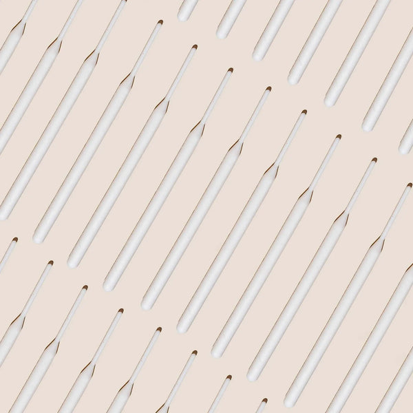 Brow Code Tinting Sticks 25-pack displayed in a diagonal pattern on a beige background, featuring sleek white sticks for precise brow application