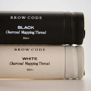 Close-up of Brow Code Black and White Charcoal Mapping Thread, 30m rolls, ideal for accurate brow shaping and professional use