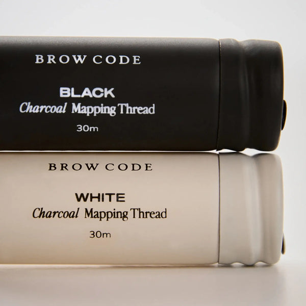Close-up of Brow Code Black and White Charcoal Mapping Thread, 30m rolls, ideal for accurate brow shaping and professional use