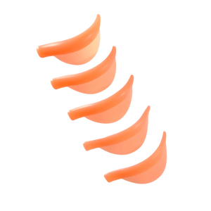Five peach-toned ÉLAN Total Curl lash lift shields arranged diagonally, ideal for dramatic curl effects in professional lash lamination services.