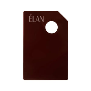 Élan Dye mixing palette in a sleek dark brown finish with a corner hole for grip, designed for blending eyebrow and eyelash tints with precision.
