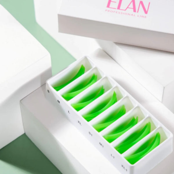 ÉLAN Lash Lift Silicone Shields in labeled tray, assorted sizes S to XL, for professional lash lifting treatments in sleek white packaging