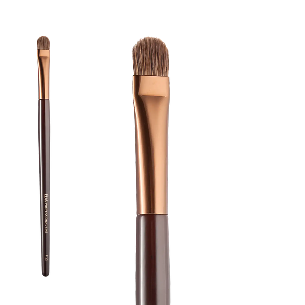 ÉLAN Professional Brush Face No.12 featuring a flat, densely packed synthetic bristle head, ideal for blending cream and powder products with precision.