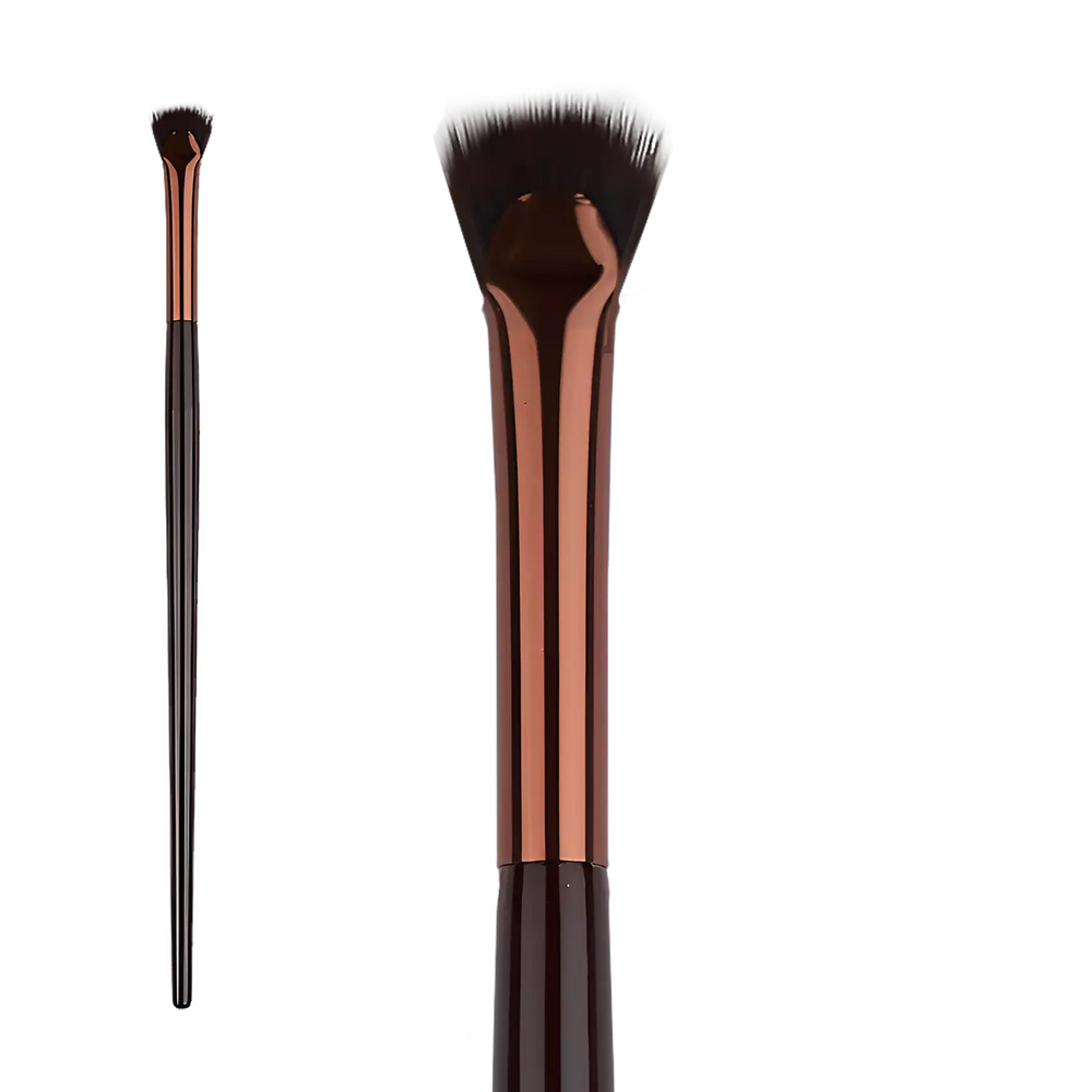 Élan Professional Brush Face No.27 featuring a unique curved synthetic bristle head and copper ferrule for sculpting and defining facial contours with precision