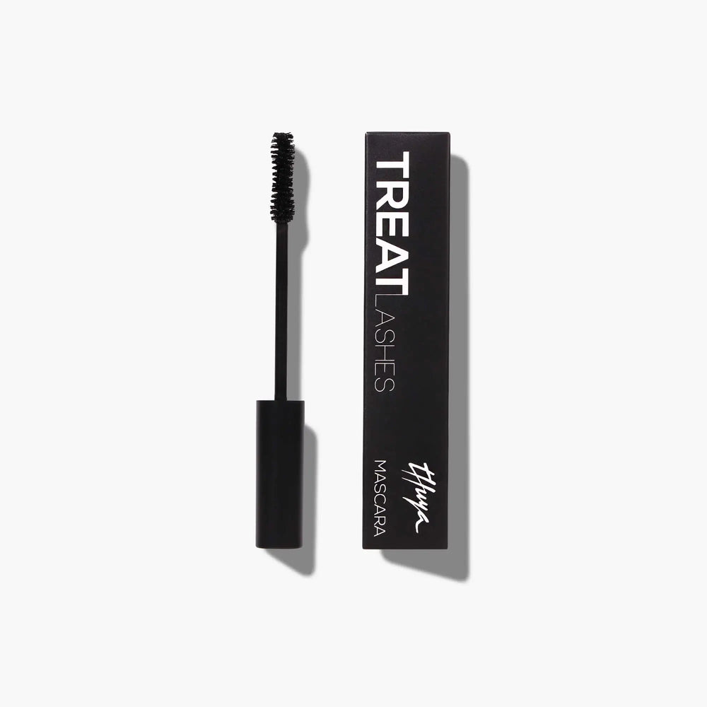 Thuya Treat Lashes Mascara with lash growth treatment formula, shown with black packaging and classic applicator wand for nourished, defined lashes.