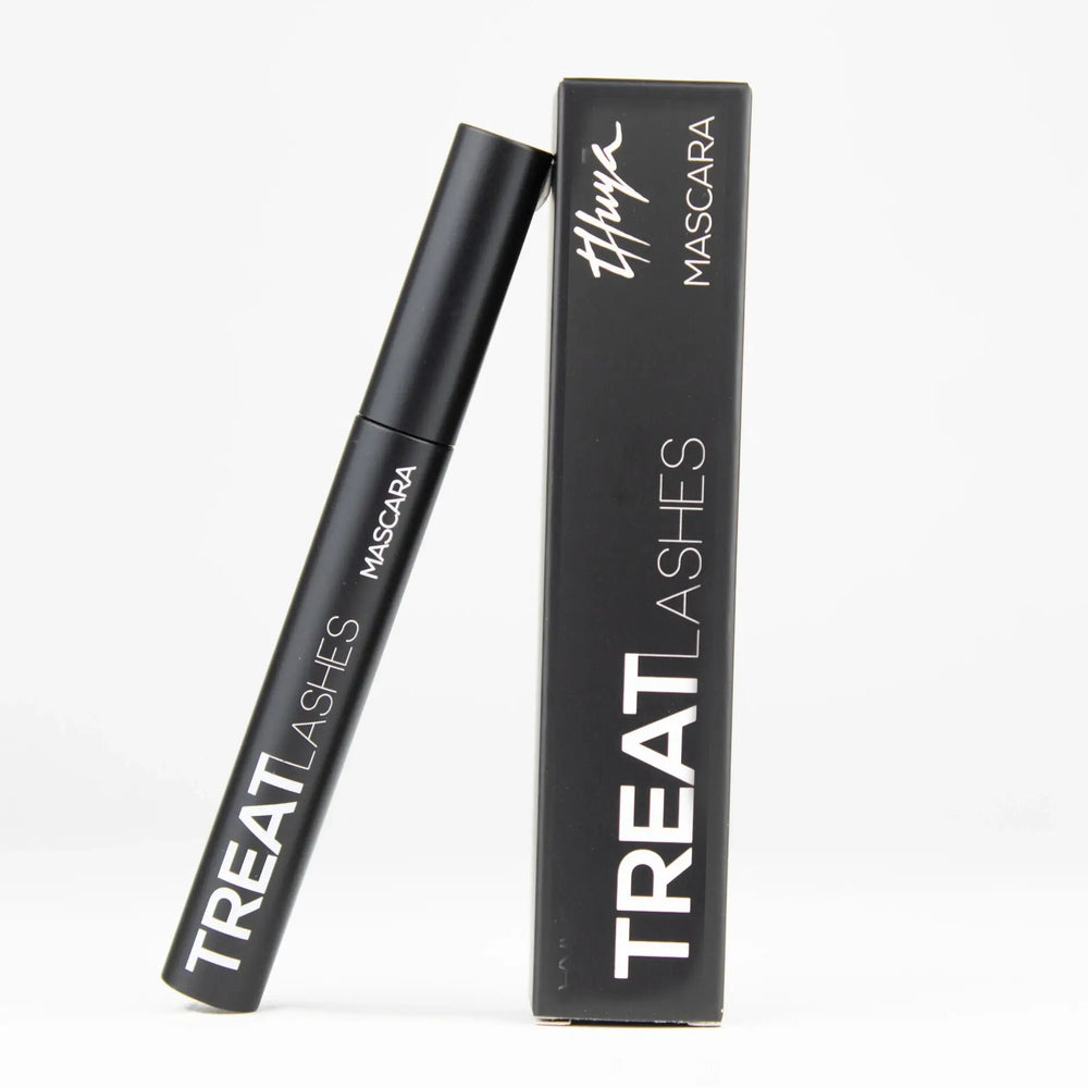 Thuya Treat Lashes Mascara with lash growth treatment formula, shown with black packaging and classic applicator wand for nourished, defined lashes.