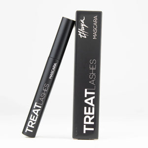 Thuya Treat Lashes Mascara with lash growth treatment, featuring sleek matte black tube and matching box for professional lash enhancement.